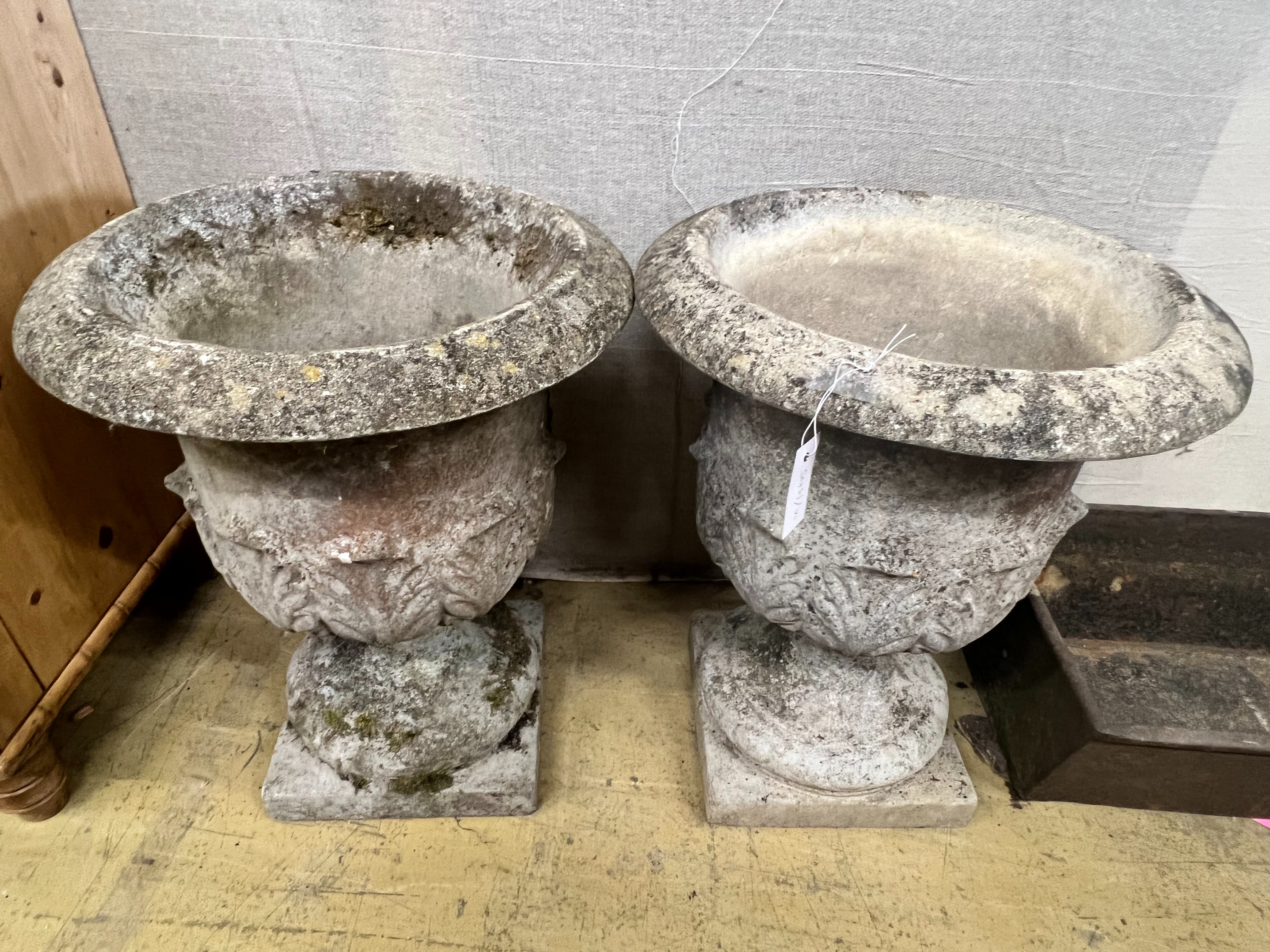 A pair of reconstituted stone acanthus moulded circular campana garden urns, diameter 49cm height 61cm